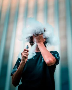 man in a cloud of smoke